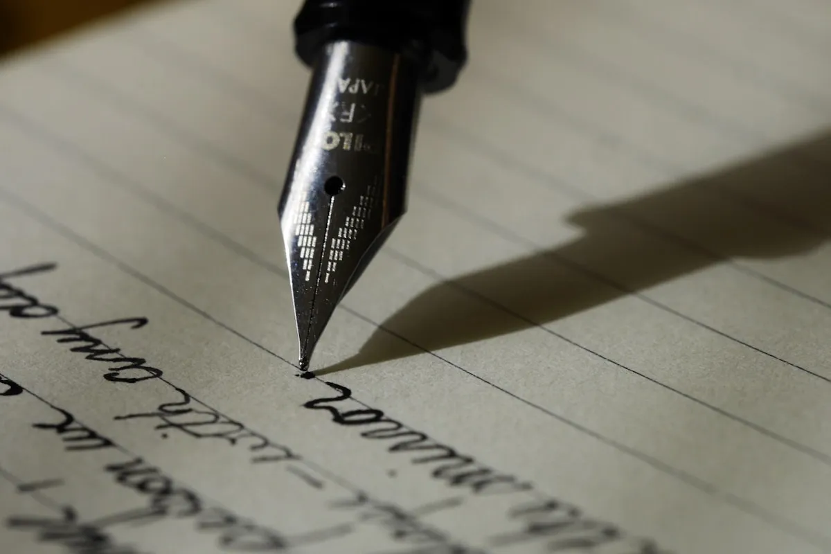A fountain pen resting on a document, symbolizing the importance of written records in trust administration
